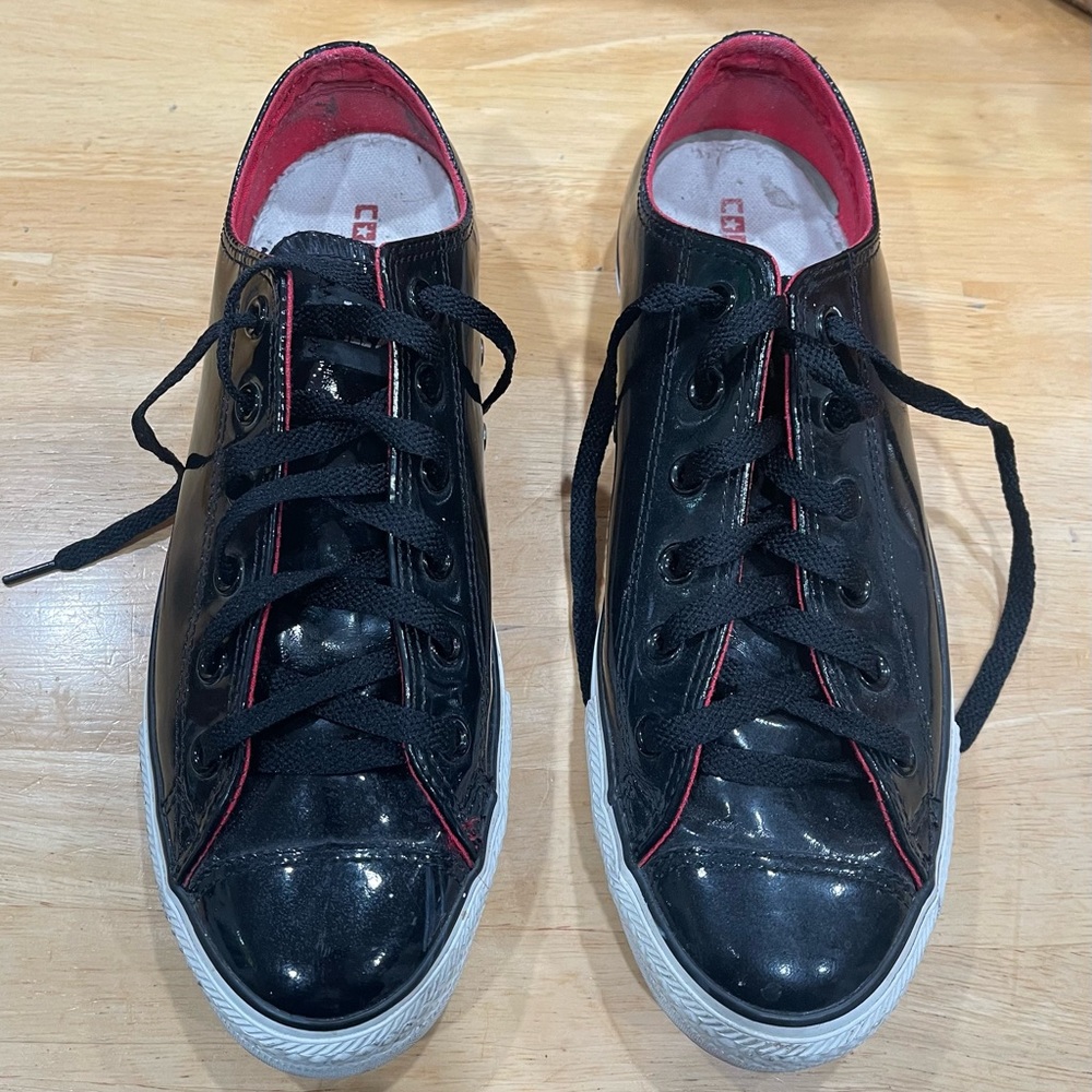 Converse Chuck Taylors. Patent, leather, low top sneakers. Lightly worn.